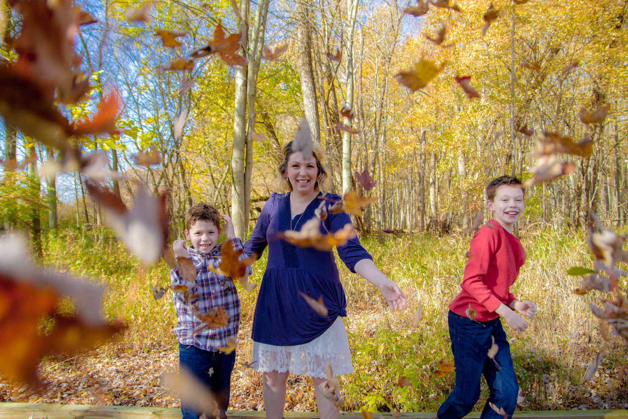 family with fall leaves